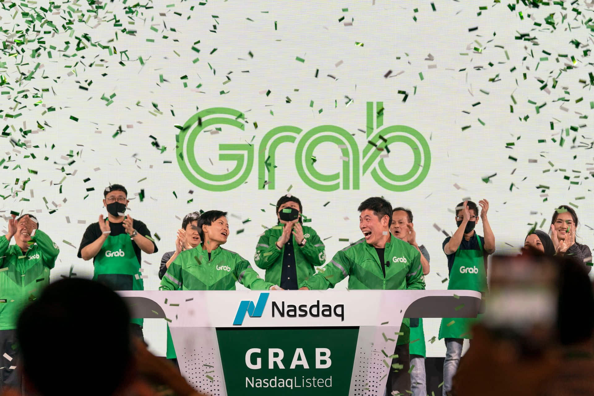 1 Grab Co Founders ring the Opening Bell in Singapore as Grab goes public on Nasdaq