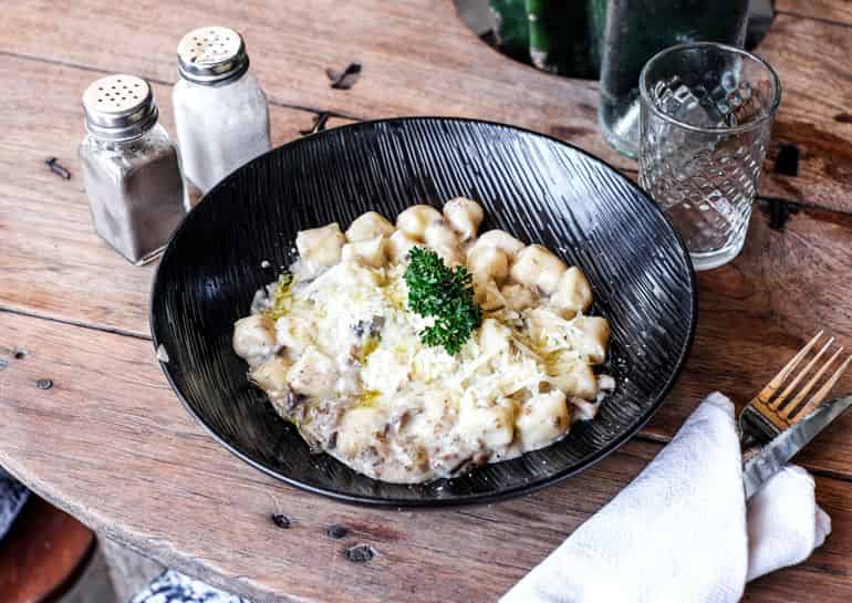 Best restaurants in Seminyak Bali: gnocchi scamorza salsiccia e funghi at La Baracca